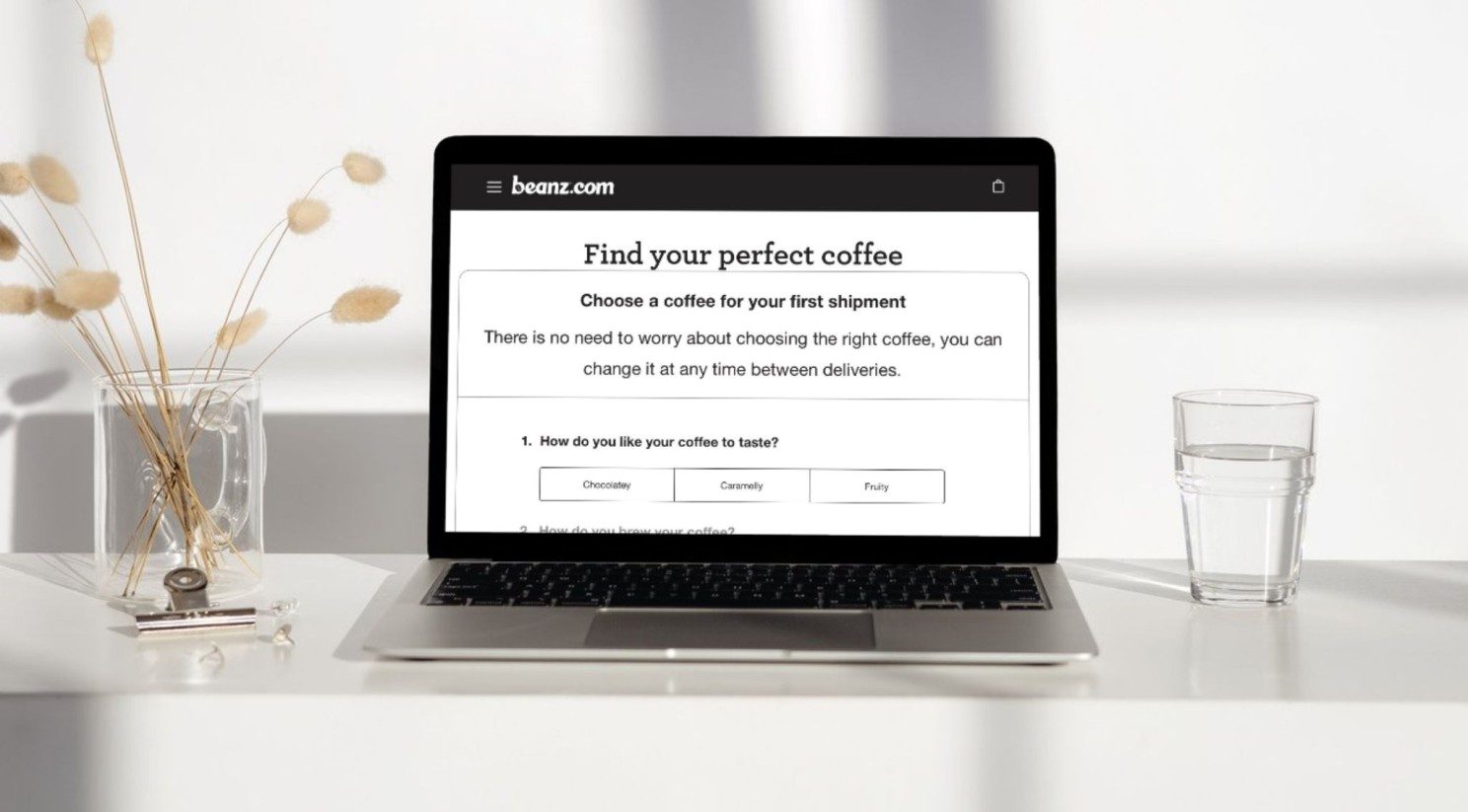 A laptop showing an online coffee subscription quiz headed “Find your perfect coffee”